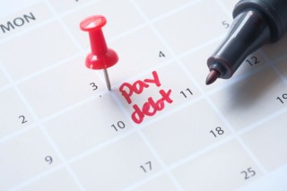 close-up-of-pay-debt-word-on-calendar-2022-11-29-23-27-17-utc